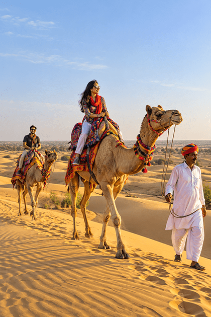 Tourists on a camel safari at Sam Sand Dunes, Jaisalmer